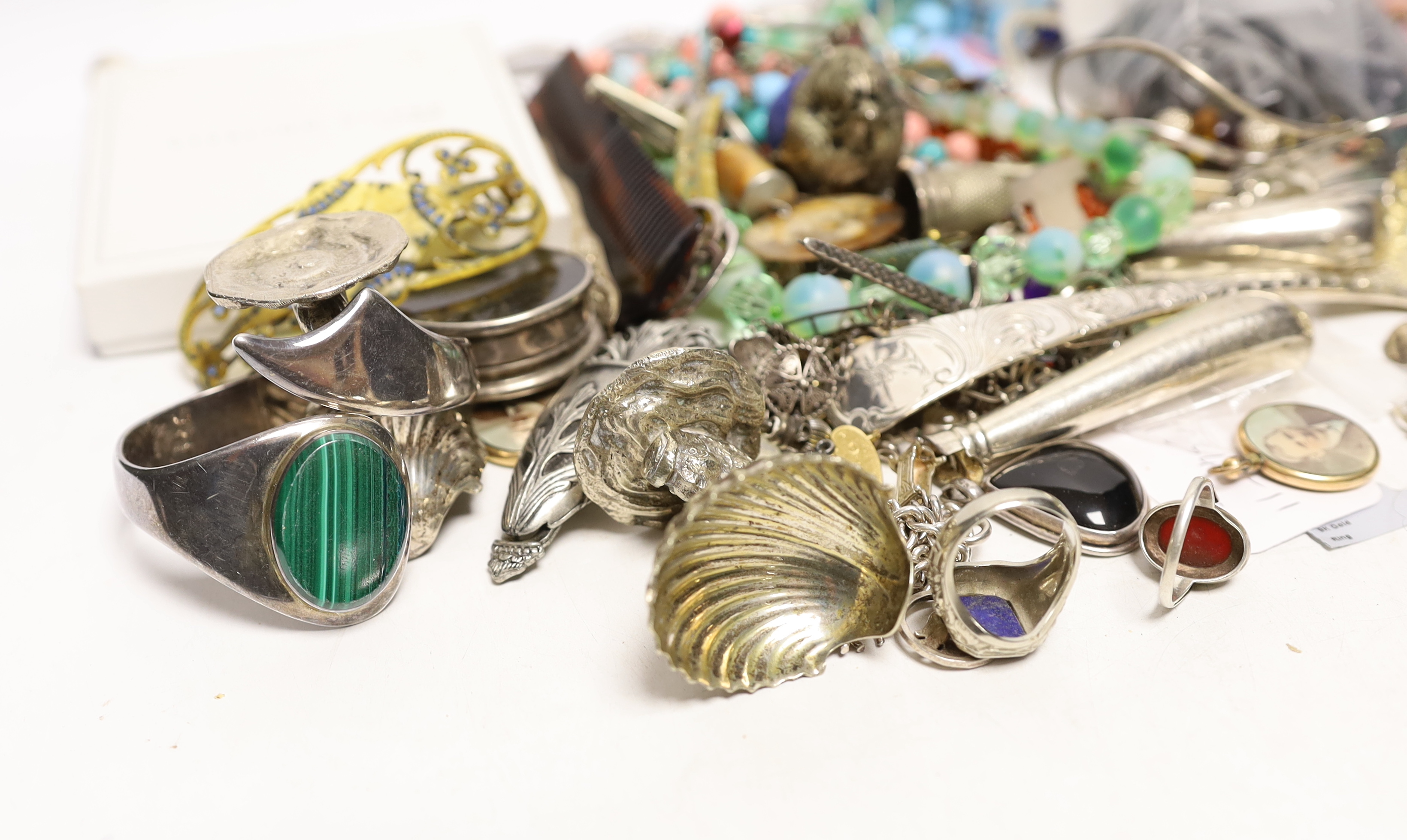 A quantity of assorted costume and other jewellery including a Charles Horner white metal and gem set brooch and sundry silver including two 19th century caddy spoons and a Georgian sifter spoon.